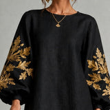 Rochie mini neagră cu mâneci tip lanternă și imprimeu auriu